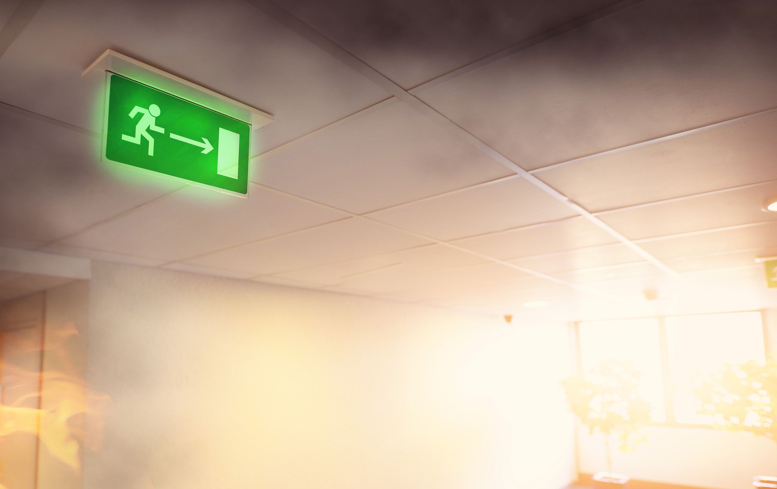 Symboldild beleuchtetes Schild für Notausgang